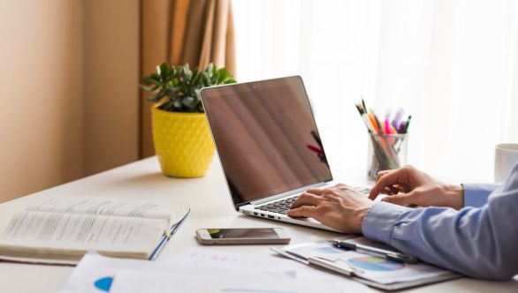 Man typing on laptop